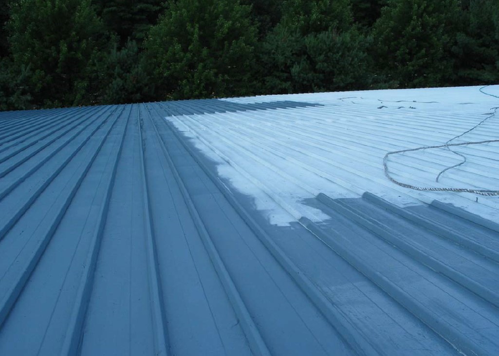 The second coat of gray RD-Elastometal is being applied